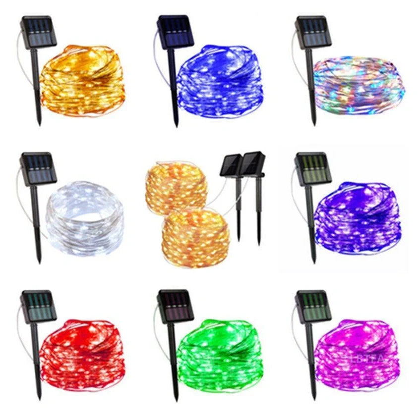 Solar-powered LED string lights arranged in garden with solar panel charging in sunlight