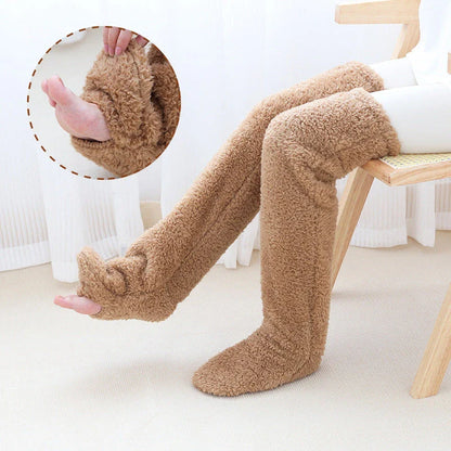 Cozy over-the-knee fuzzy socks in various colors, including brown, blue, dark gray, pink, silver, and more. Comfortable cotton design for warm, snug legs.