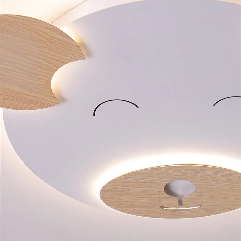 Cartoon bear shaped ceiling lamp with wrought iron frame for a princess themed room.