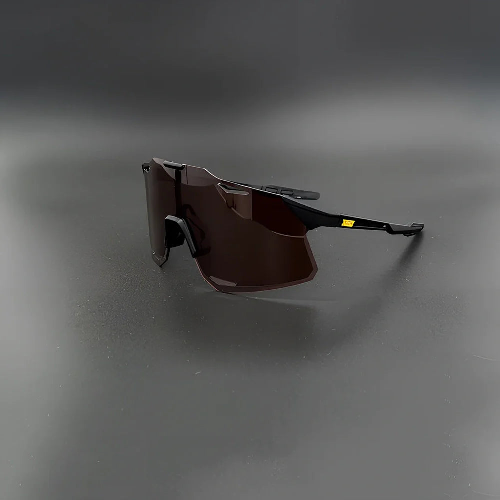 Cycling glasses with interchangeable lenses showing UV400 protection and lightweight frame design