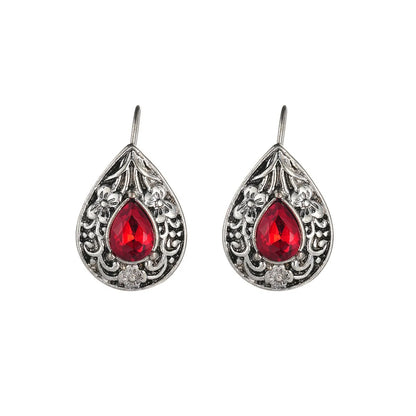 Pair of retro Bohemian carved drop earrings in red alloy for women, shown as a single pair