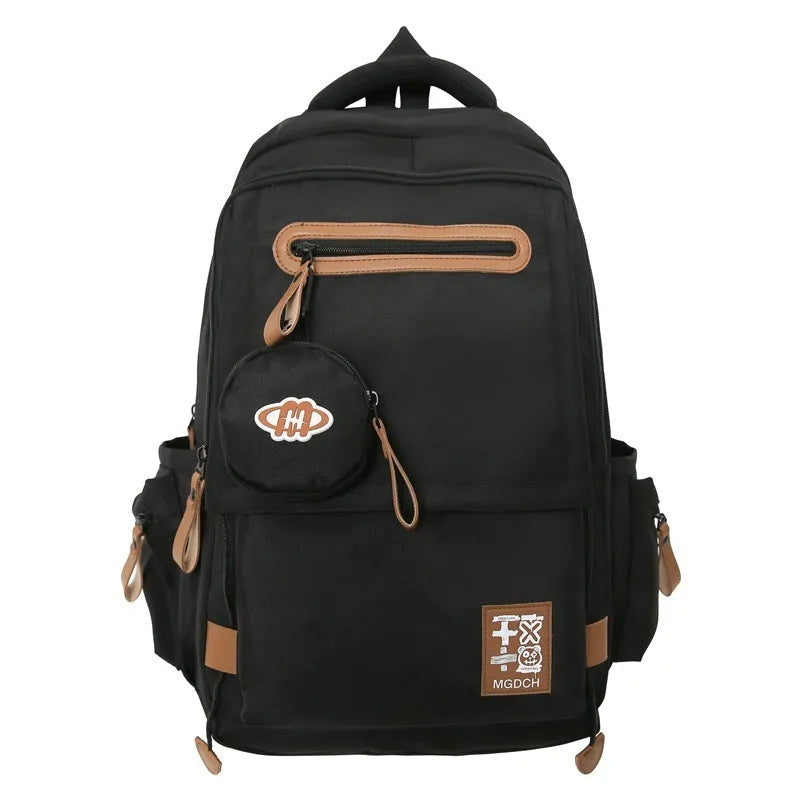 Large nylon school backpack for middle school students in a solid colour with curved shoulder straps.