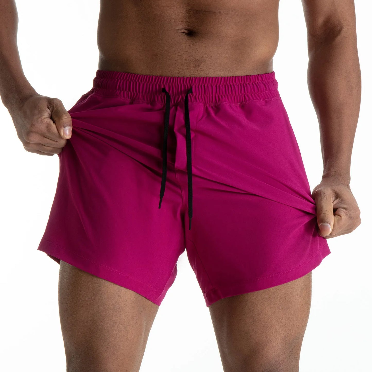 Man wearing black quick-dry polyester sports shorts suitable for running or gym workouts.