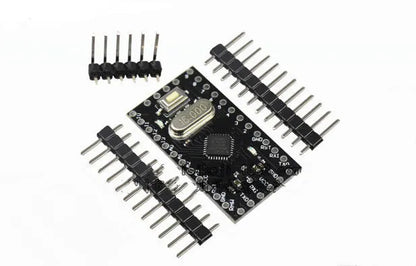 Mini Pro microcontroller circuit board measuring 33.3mm by 18.0mm with pin headers and Atmega328P chip