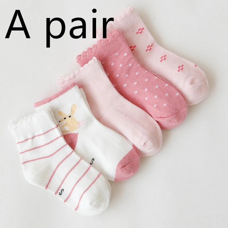 Kids' cartoon stockings with jacquard designs in various colors and patterns