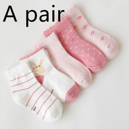 Kids' cartoon stockings with jacquard designs in various colors and patterns