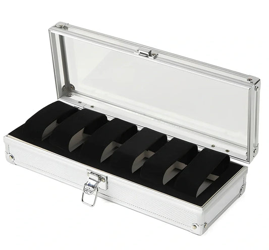 Aluminium watch storage box with clear lid showing six velvet-lined compartments for watch collection
