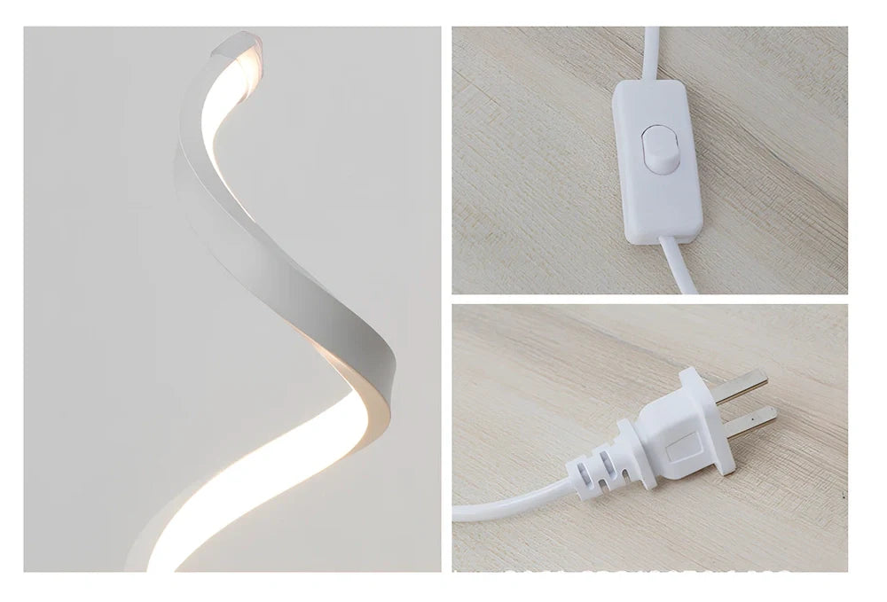 Modern table lamp with curved design, metal base, and acrylic shade offering remote-controlled dimming between warm and white light