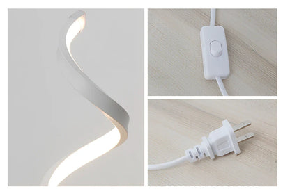 Modern table lamp with curved design, metal base, and acrylic shade offering remote-controlled dimming between warm and white light