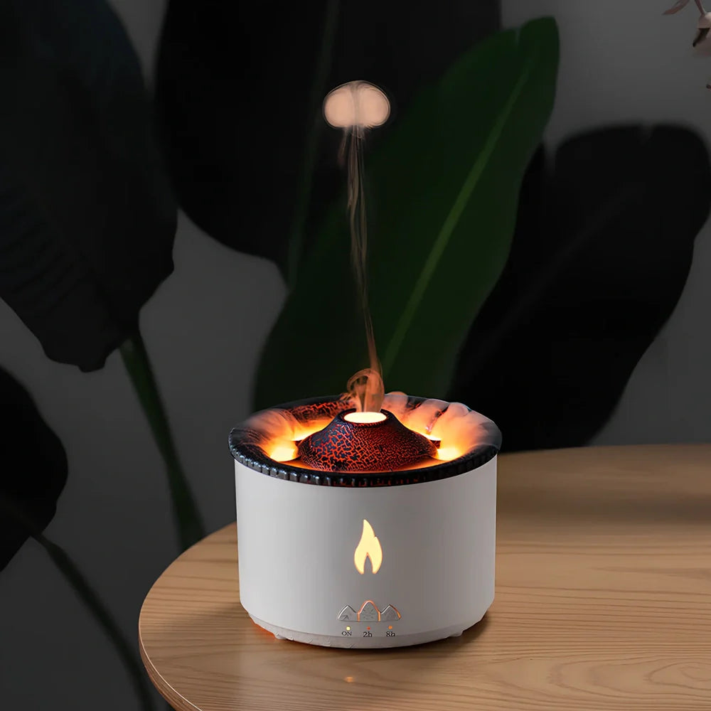 White volcano-shaped humidifier diffuser with flame lighting effect and remote control on wooden surface