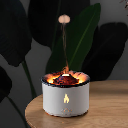 White volcano-shaped humidifier diffuser with flame lighting effect and remote control on wooden surface