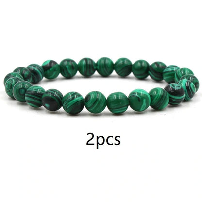 Elegant malachite stone bracelets with unique textures and patterns, perfect for a stylish accessory.