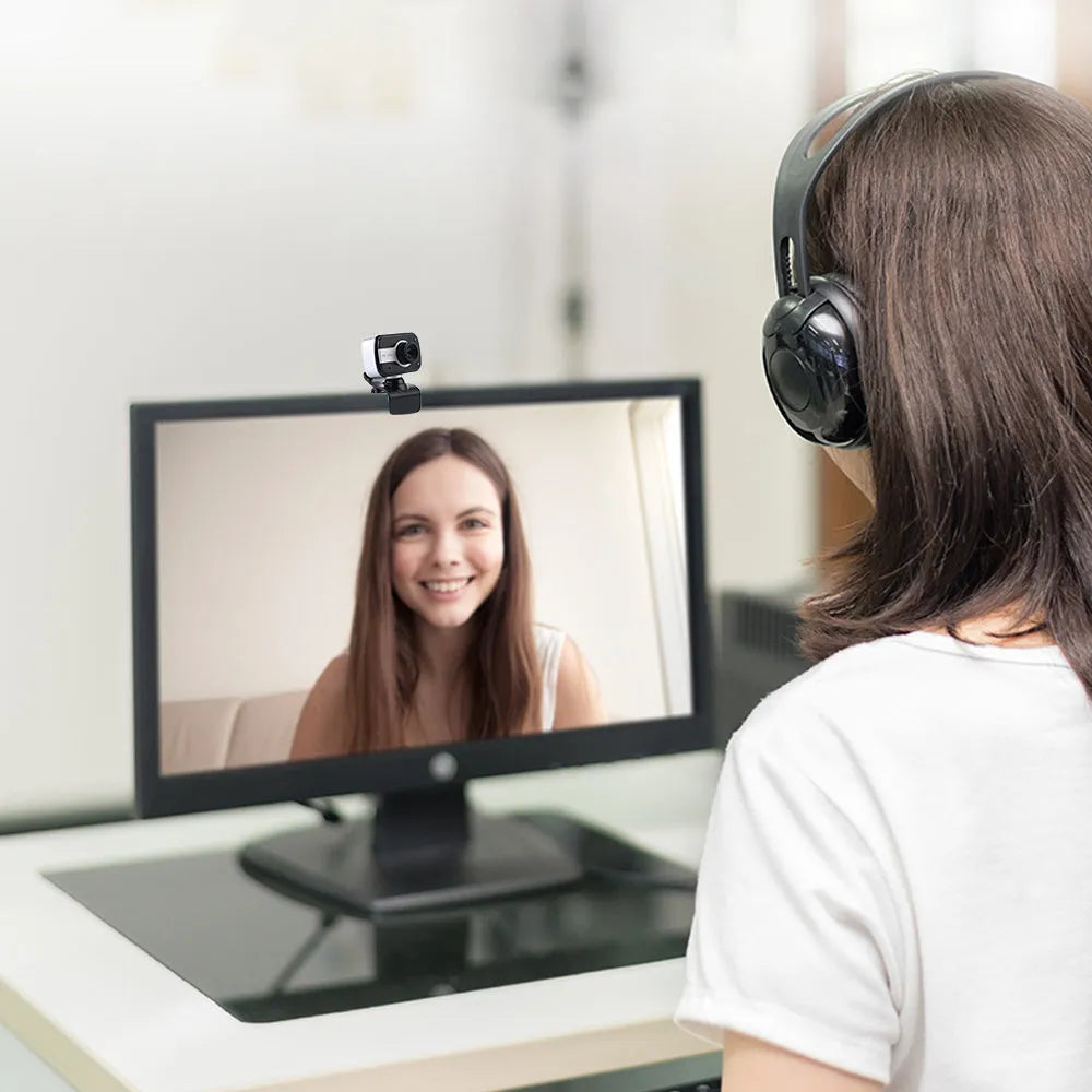 Blue, red, or white mini USB webcam on a stand with a 360-degree rotating head and manual focus adjustment.
