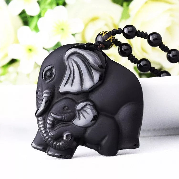 Hand-carved obsidian elephant pendant necklace with stretch bead chain for wealth and protection