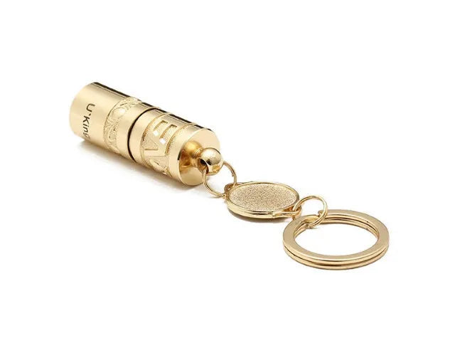 Gold electroplated waterproof mini LED keychain torch with zinc alloy body on a keyring.