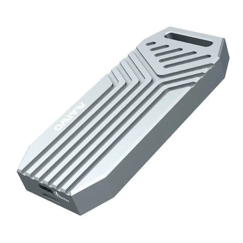 Silver aluminium Thunderbolt 4 external SSD enclosure for M.2 drives, shown next to a MacBook.