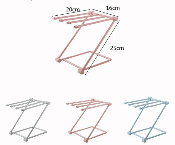 Foldable plastic dishcloth shelf organiser in Nordic style mounted on a kitchen wall