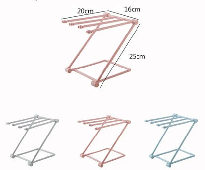 Foldable plastic dishcloth shelf organiser in Nordic style mounted on a kitchen wall