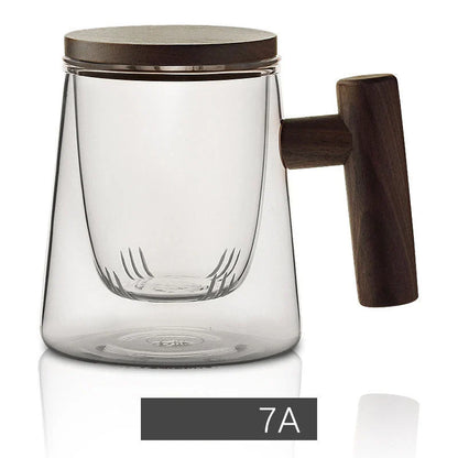 Premium glass tea infuser cup with wooden handle, offering a unique tea-water separation system and temperature-resistant construction for a refined tea experience.
