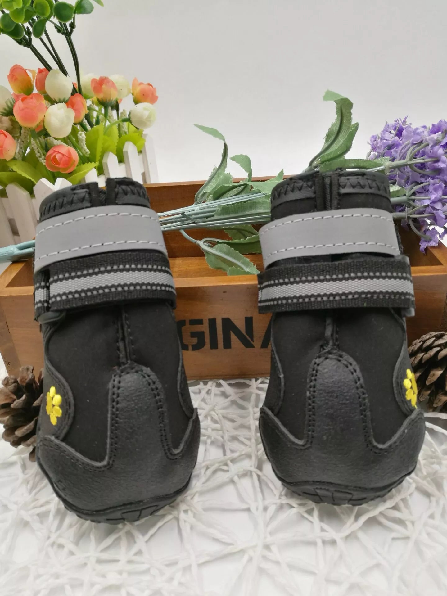 Black waterproof dog shoes with non-slip soles and adjustable fuzzy belts