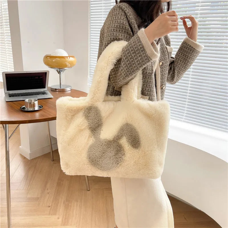 Cute cartoon rabbit ears design on a soft plush large capacity shoulder tote bag.