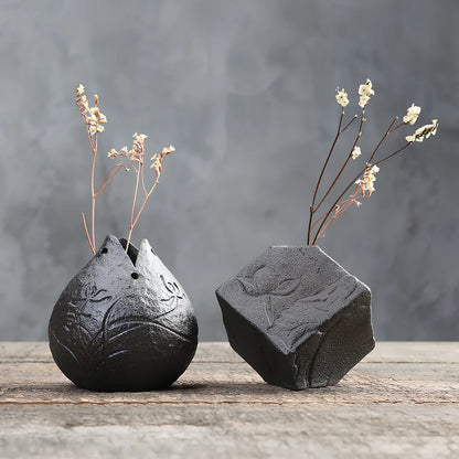 Handmade stoneware Zen Chinese flower arrangement vase with floating lotus device on wooden table