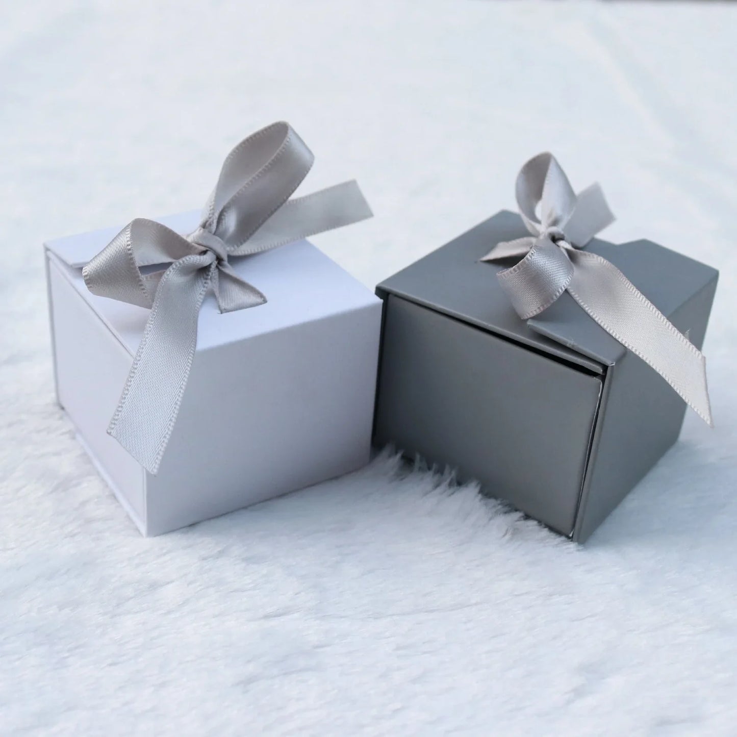 Square grey jewellery gift box with ribbon bow measuring 5x5cm for ring and earring storage