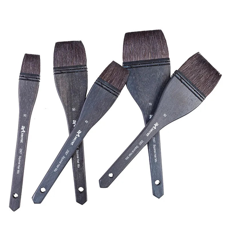 Grey squirrel hair makeup brush with a wooden handle on a plain background