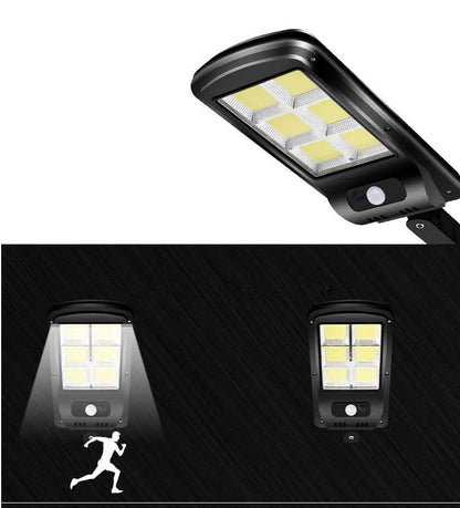 Black solar motion sensor security light for outdoor garden or fence installation with IP65 waterproof rating