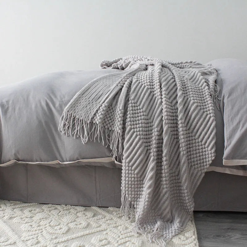 Polyester small blanket shown in dark grey, measuring 127 by 170 centimetres.