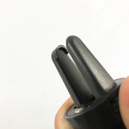 Matt black universal car phone holder with flexible gooseneck arm attached to car air vent