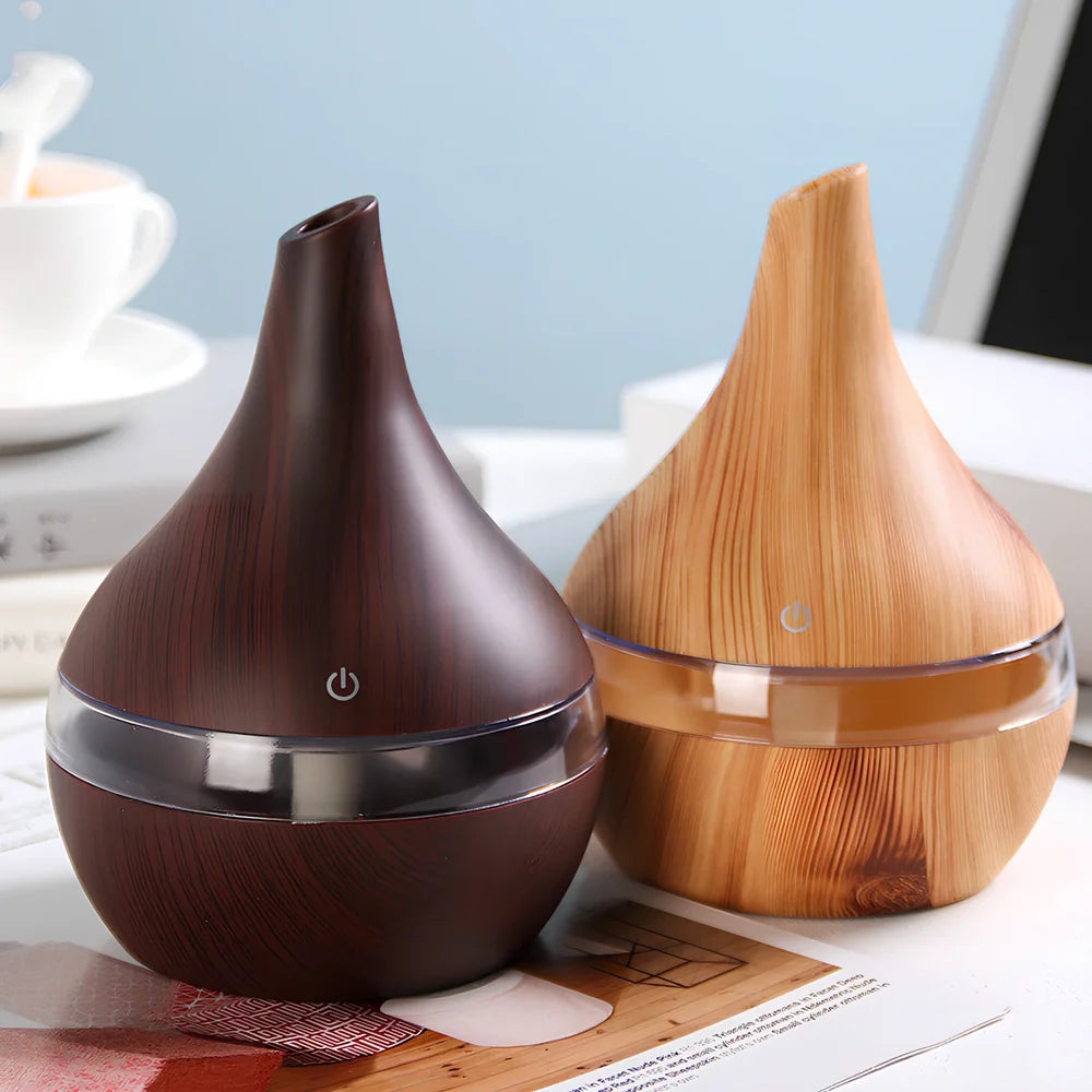 Round wood grain humidifier with USB cable on wooden surface