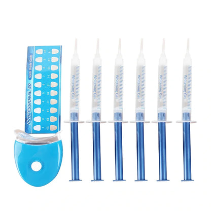 Teeth whitening gel kit with thermoform trays, cold light lamp, 10 gel syringes, and 3D shade guide showing 7-10 improvement