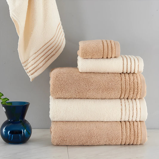 Beige and brown cotton towel set showing bath, hand, and face towel sizes.