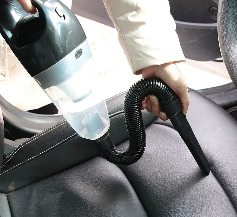 12V portable car vacuum cleaner in orange colour with power cord and interchangeable nozzles