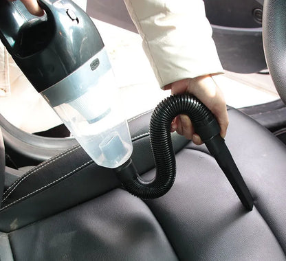 12V portable car vacuum cleaner in orange colour with power cord and interchangeable nozzles