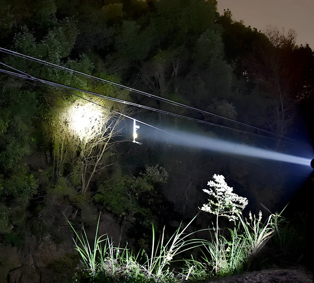 Green camping light with LED display showing multiple lighting modes and USB charging port