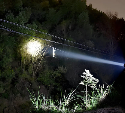 Green camping light with LED display showing multiple lighting modes and USB charging port