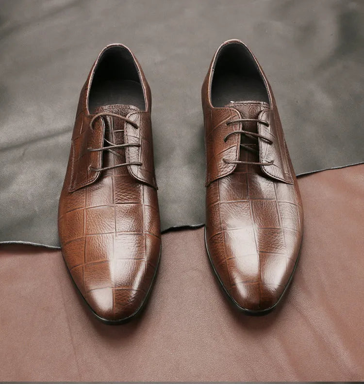 Men's black leather derby shoes with pointed toe, visible sewing details, and antiskid rubber soles