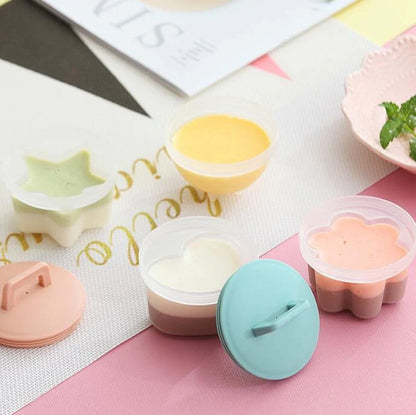 BPA-free multi-function egg cooker with four molds in gray, pink, and green