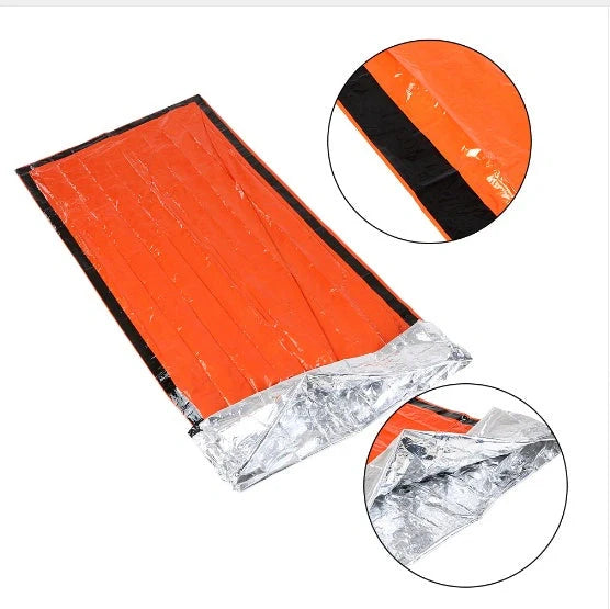 Orange First-aid Tent Insulation Mat reflecting sunlight, ready for emergency use