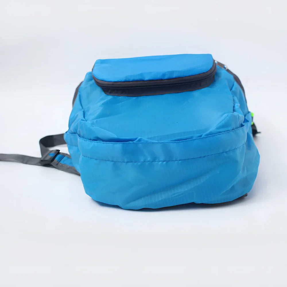 Yellow foldable sports backpack showing 30.5x42cm dimensions and compression feature