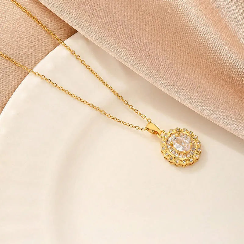 Women's gold electroplated copper necklace showing four pendant options: heart, butterfly, cross and round diamond