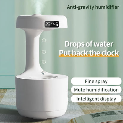 White columnar anti-gravity humidifier with LED clock display on a wooden desk
