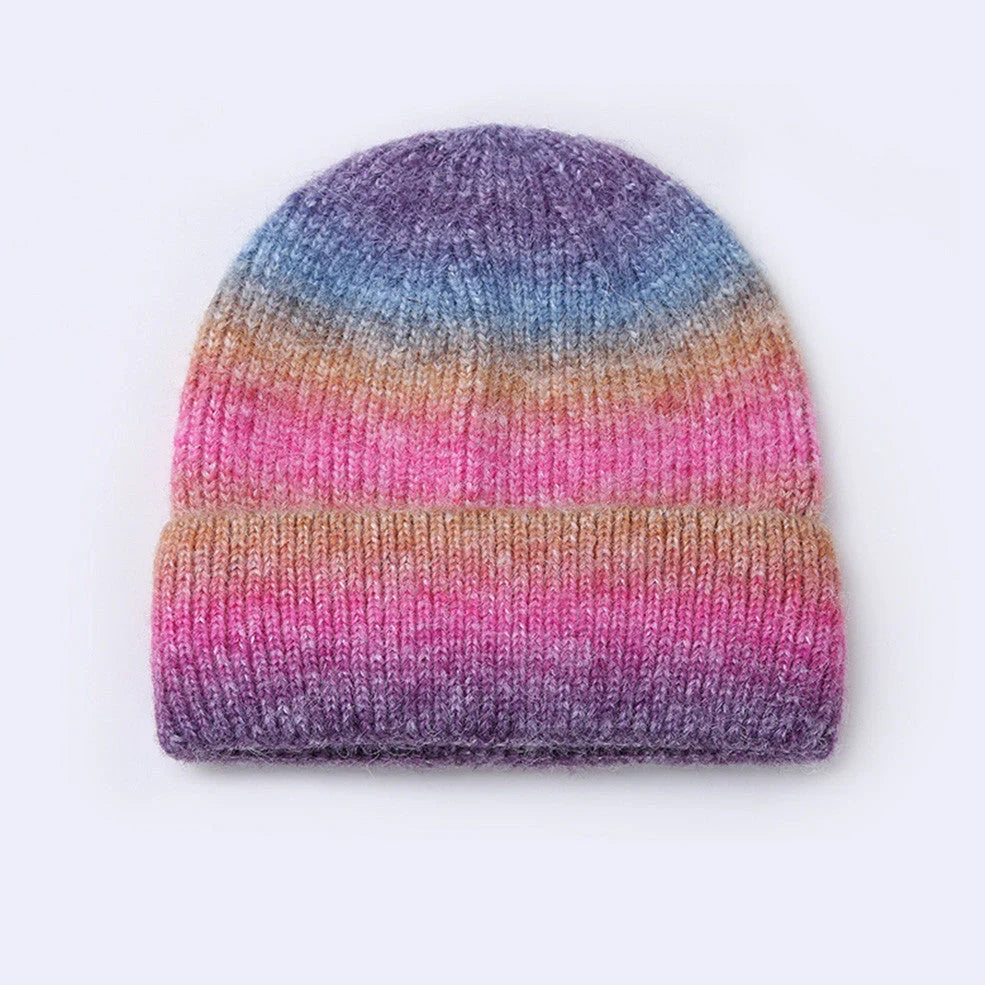 Gradient yarn knitted hat with tapered top in light blue colour showing knitted texture