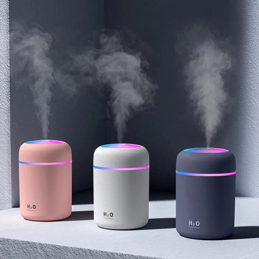 Compact and Quiet Bedroom Mist Humidifier with Soothing Mood Lighting in White, Navy Blue, and Pink Colors