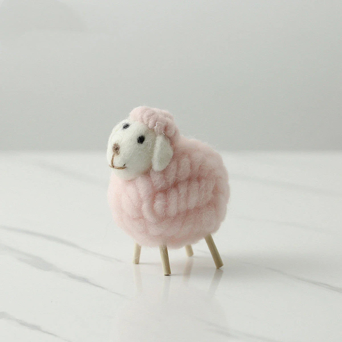Adorable plush sheep decorations in various sizes and color combinations, perfect for adding a cozy, farmhouse-inspired touch to any home.