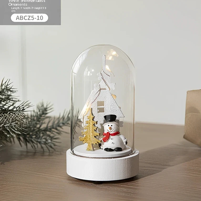 Small 15 cm glass reindeer night lamp in white snowman cabin style casting 100 lumen festive glow on table