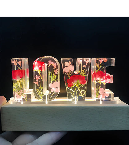 Wooden LOVE letter table lamp with dried flowers and warm LED light for bedroom use