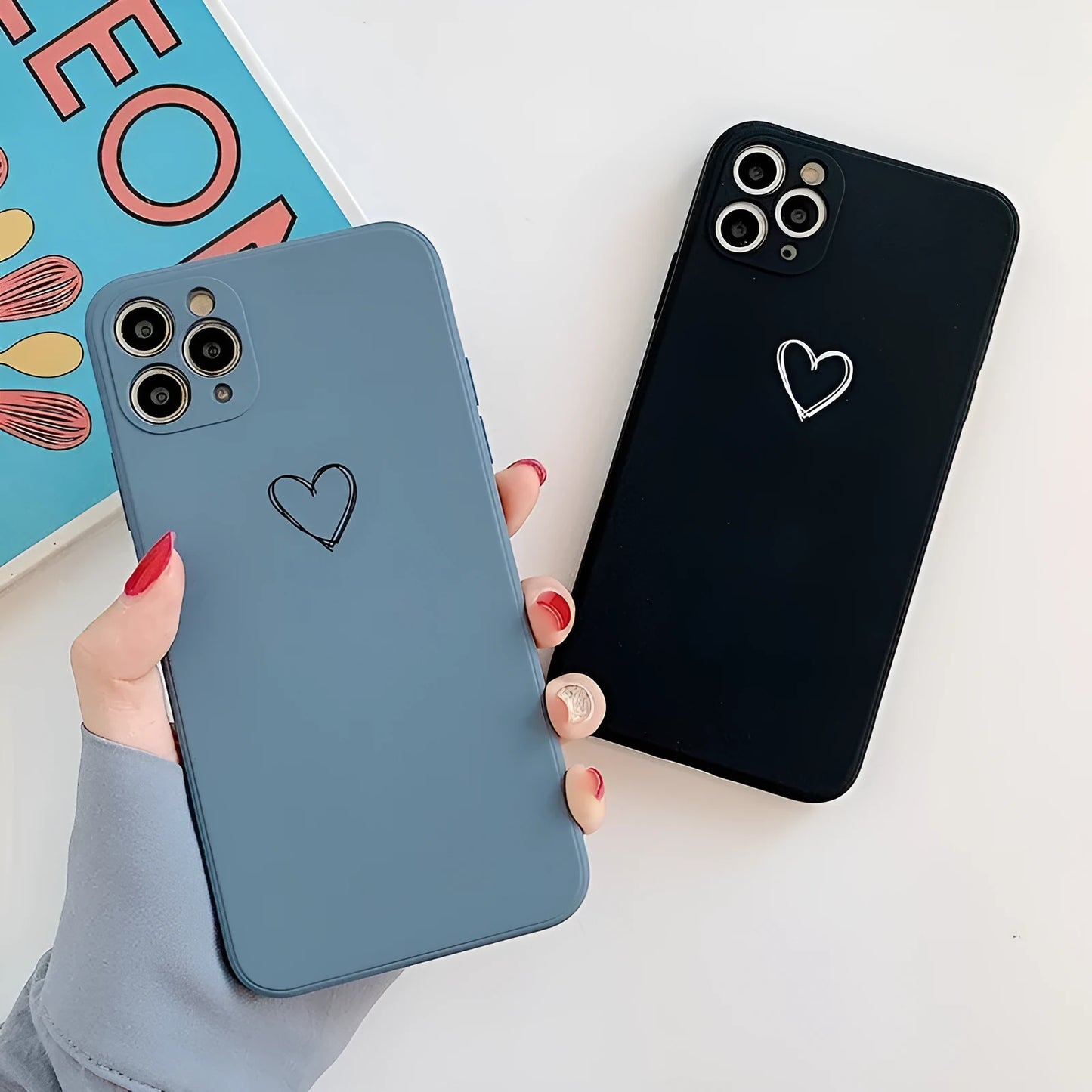 Silicone iPhone case in solid colours like black, green, pink, and white, showing TPU material and slim back cover design